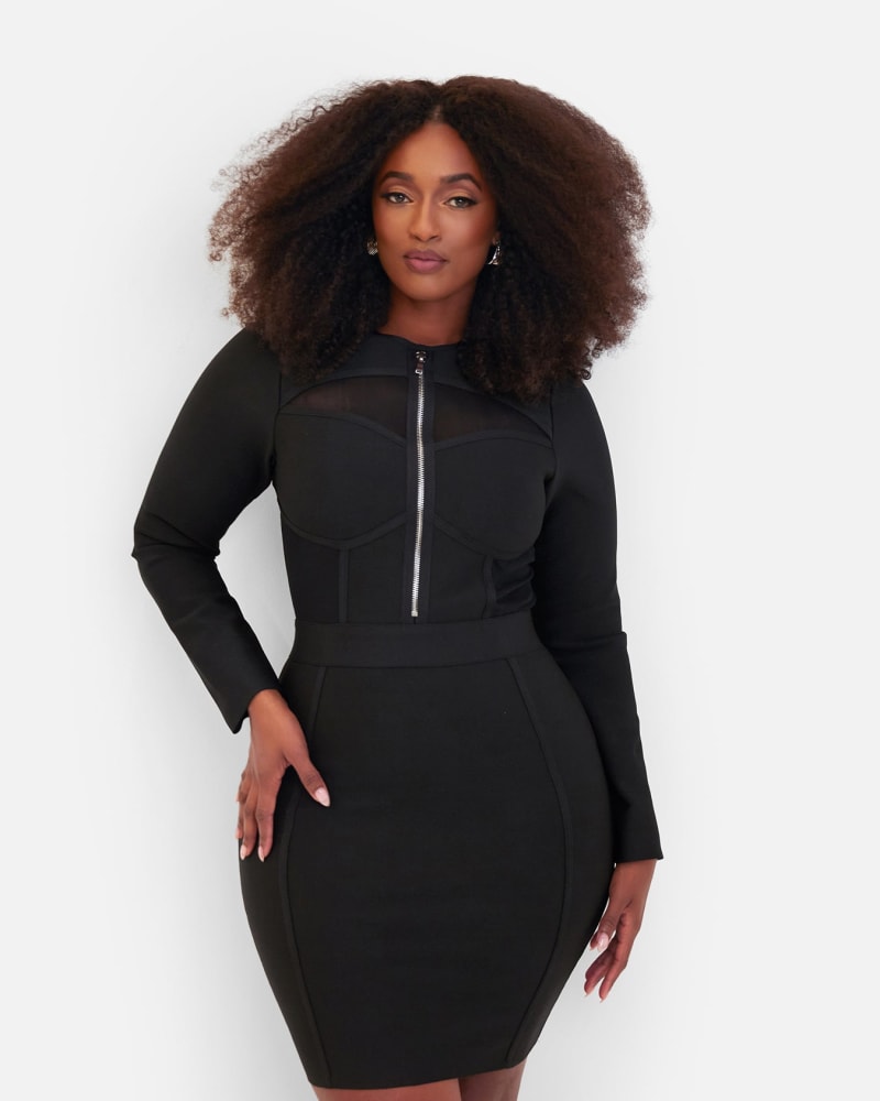 Side of a model wearing a size 2X Pressure Long Sleeve Zipper Bodice Bandage Mini Dress - Black in Black by Rebdolls. | dia_product_style_image_id:321486